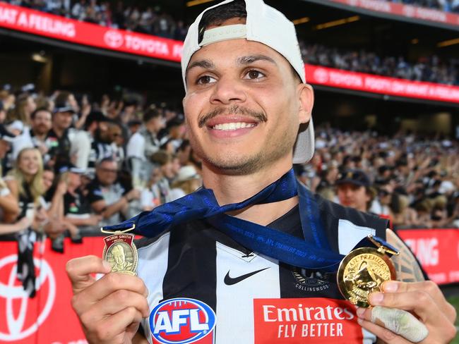 MELBOURNE, AUSTRALIA - SEPTEMBER 30: Bobby Hill of the Magpies celebrates winning the Norm Smith edal and premiership during the 2023 AFL Grand Final match between Collingwood Magpies and Brisbane Lions at Melbourne Cricket Ground, on September 30, 2023, in Melbourne, Australia. (Photo by Quinn Rooney/Getty Images)