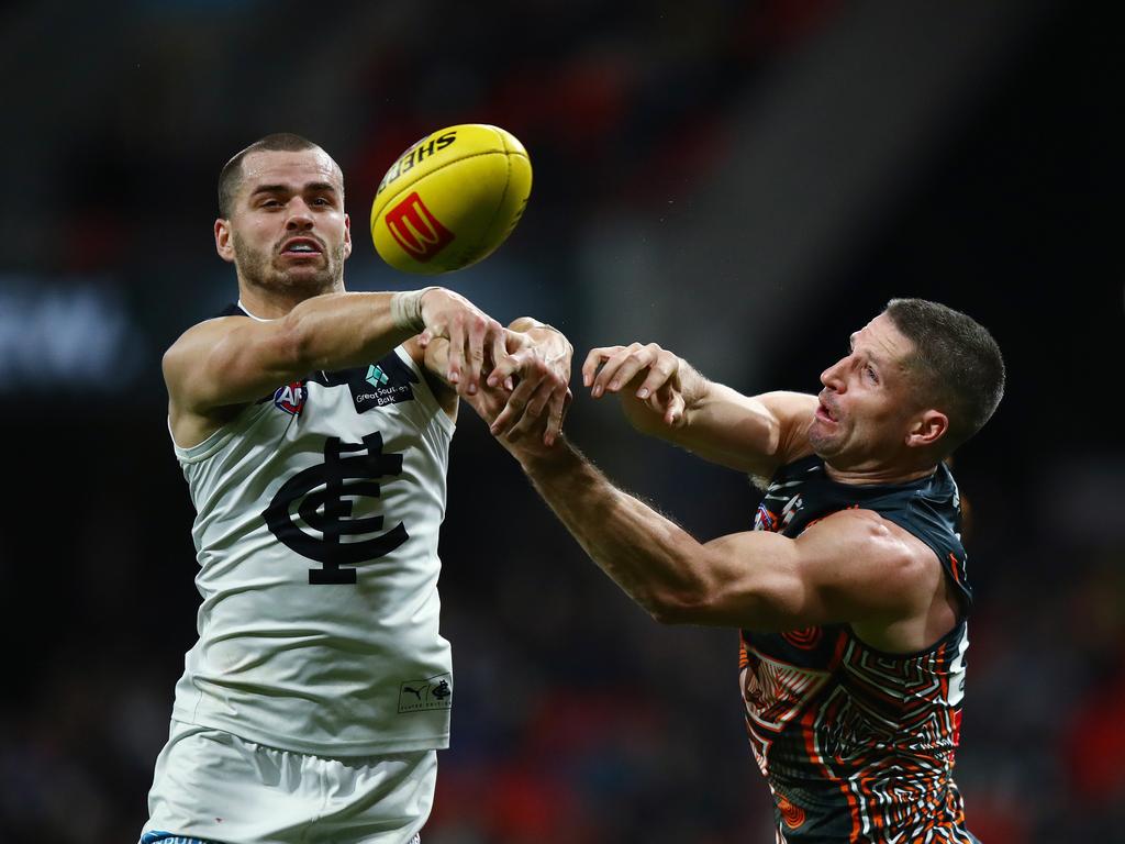 Carlton's Brodie Kemp and Giants Jesse Hogan battle in the air on Saturday night. Picture: Brett Costello.