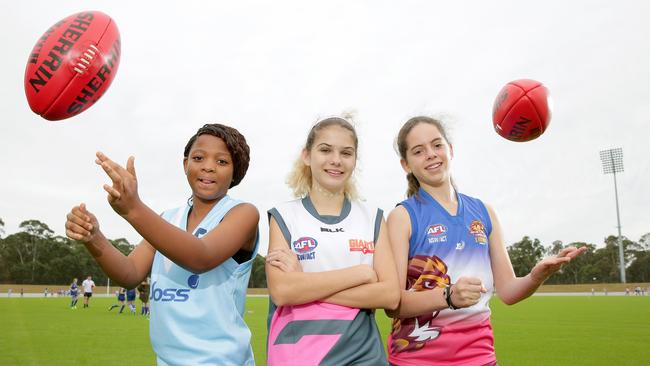 Harriet Owusu, 12, Shelby Draper, 13, Tahlia Ravello, 12, at Blacktown International Sports Park. Photo: Adam Ward