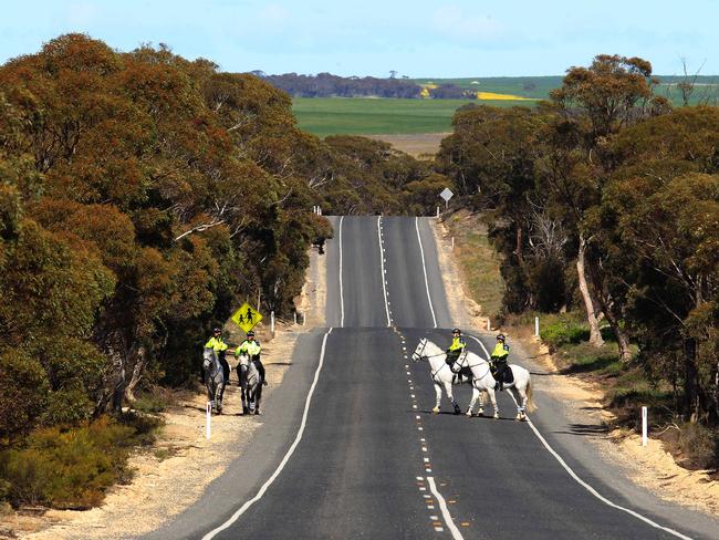 Mounted police search along the highway between Wynarka and Karoonda for evidence after the discovery of Khandalyce’s remains in a suitcase. Picture: Dean Martin