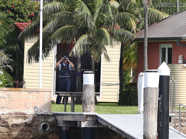 Security peers through binoculars at Malcolm Turnbull’s Point Piper mansion in Sydney's east. Picture: John Feder/The Australian