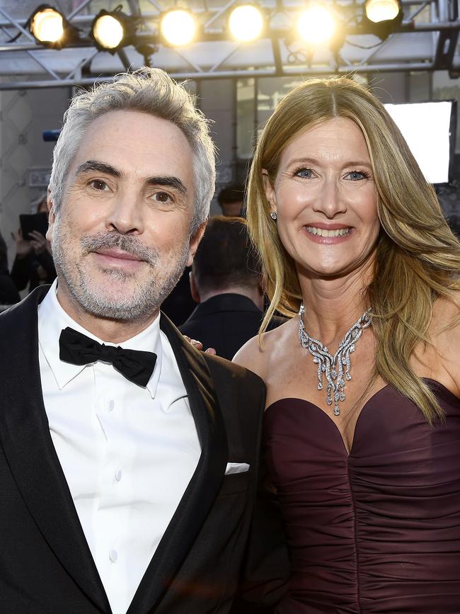 Director Alfonso Cuaron and Laura Dern attend the Oscars. Picture: Getty