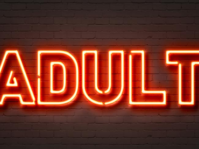 Adult neon sign on brick wall background. Picture: iSTOCKNo People; Women; Glowing; Pornography; Illustration; Brothel; Nightlife; Stripper; Adult; Backgrounds; Illuminated; Sensuality; Multi Colored; Night; Decoration; Store; Sign. Generic brothel