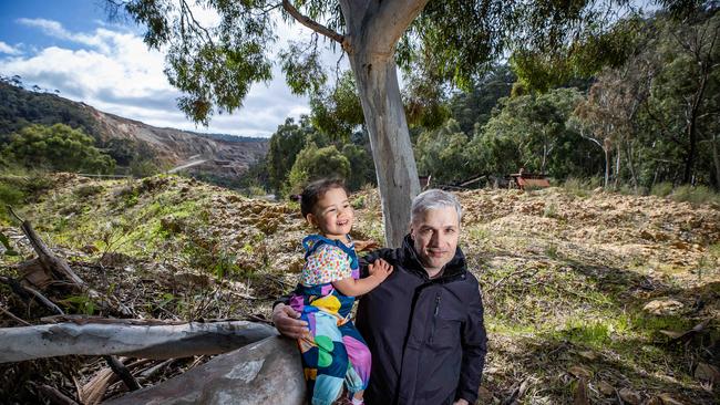 Residents Against White Rock Quarry leader Demetrios (Jim) Bastiras of Skye with his 2-year-old daughter Artemis at Horsnell Conservation Park where White Rock Quarry has taken over the park. Picture: Tom Huntley