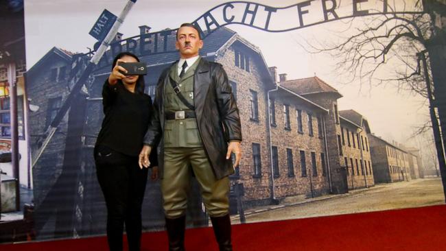 An Indonesian museum that allowed visitors to take selfies with a life-size wax sculpture of Hitler against a backdrop of Auschwitz concentration camp has removed the exhibit following international outrage. Picture: Henry Anto/AFP