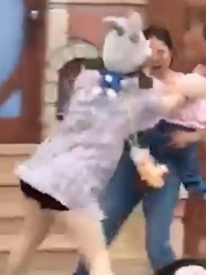 One woman pushed the woman with a child.