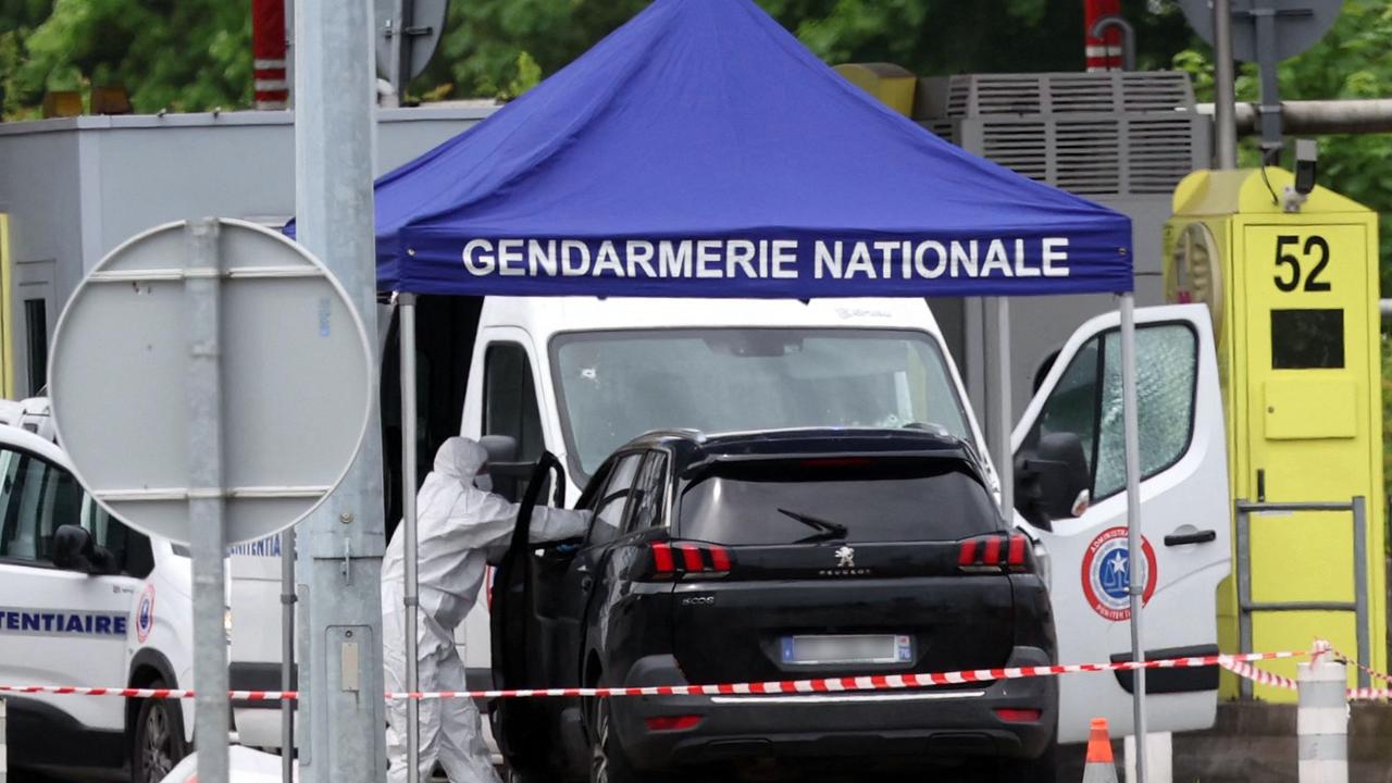 A forensic is at work at the site of a ramming attack. Picture: AFP