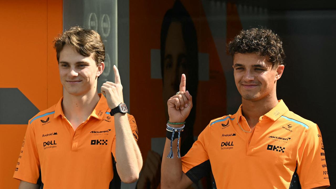 McLaren's Australian driver Oscar Piastri (L) and McLaren's British driver Lando Norris pose ahead of the Formula One Azerbaijan Grand Prix in Baku on September 12, 2024. (Photo by Natalia KOLESNIKOVA / AFP)