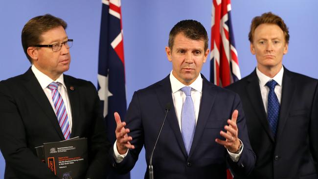 Premier Mike Baird announces the greyhound shut down, with Deputy Premier Tony Grant and RSPCA CEO Steve Coleman today. Picture: Stephen Cooper