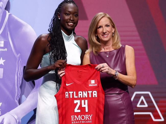 NEW YORK, NEW YORK - APRIL 15: Nyadiew Puoch poses with WNBA Commissioner Cathy Engelbert after being selected 12th overall pick by the Atlanta Dream during the 2024 WNBA Draft at Brooklyn Academy of Music on April 15, 2024 in New York City. Sarah Stier/Getty Images/AFP (Photo by Sarah Stier / GETTY IMAGES NORTH AMERICA / Getty Images via AFP)