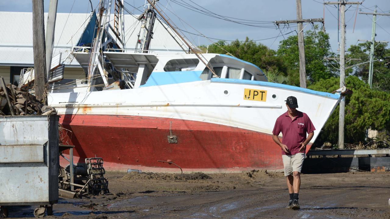 News 1.2.2013, Courier Mail Bundaberg, A trawler sits high &amp; dry in Quay st Bundaberg after the flood. Photo Paul Beutel