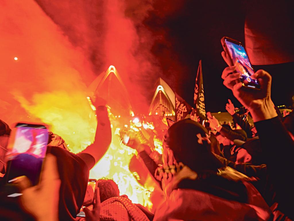 An Israeli flag is set on fire at the pro-Palestine protest at the Opera House on October 9, 2023. Picture: Jeremy Piper