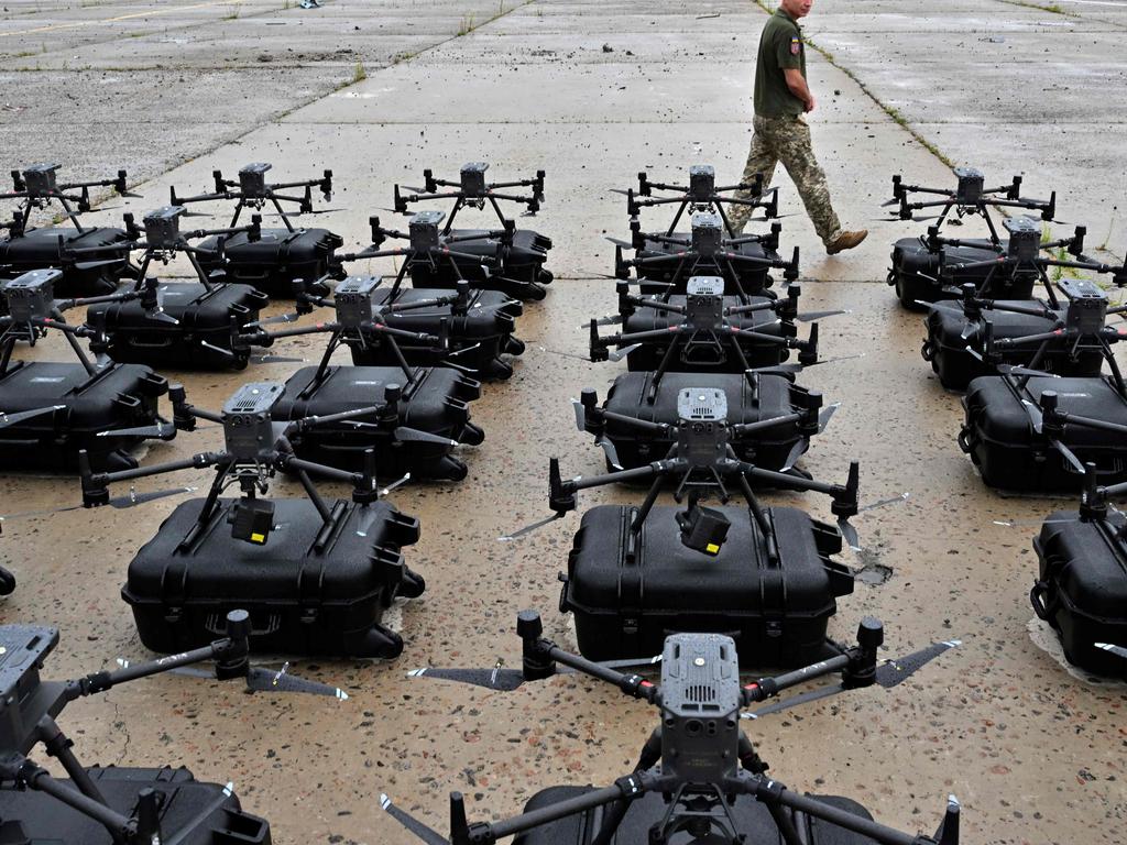 A military operator walks past DJI Matrice 300 reconnaissance drones, bought in the frame of the program 'The Army of Drones' Picture: AFP