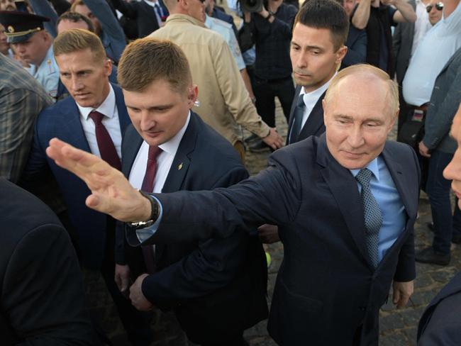 In this pool photograph distributed by the Russian state agency Sputnik, Russia's President Vladimir Putin meets with believers while visiting the Trinity Lavra of St. Sergius in the town of Sergiyev Posad outside Moscow on June 26, 2024. (Photo by Alexey NIKOLSKY / POOL / AFP)