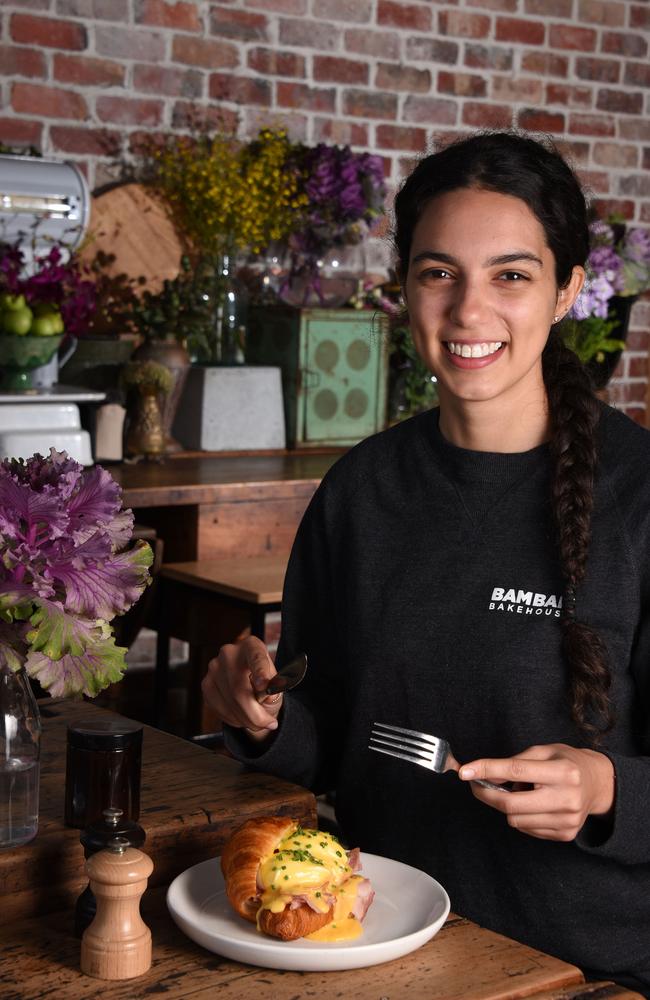 Elisha Lock with the best eggs benny on the Gold Coast at Bam Bam Bakehouse. Photo: Steve Holland