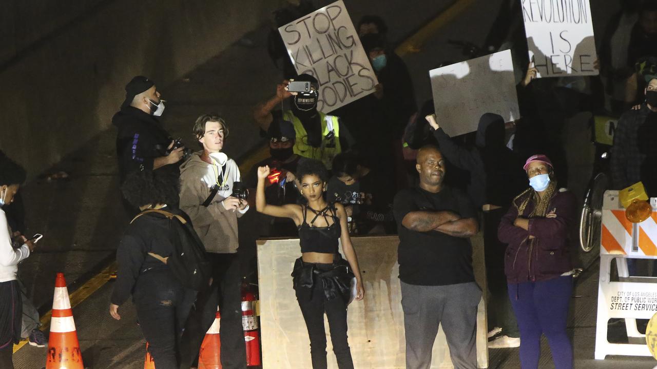 Demonstrators shut down the northbound CA-110 freeway on Friday. Picture: Damian Dovarganes/AP