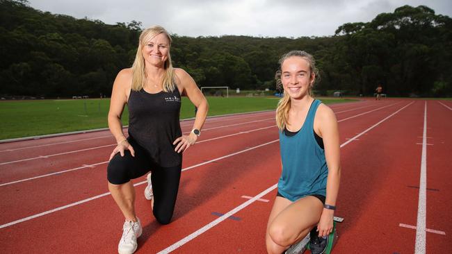 ‘It is really difficult for the young ones these days’: Olympian Melinda Gainsford-Taylor at Narrabeen, Sydney, with 15-year-old Sally Priest on Thursday. Picture: Ryan Osland