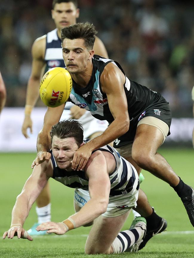 Port’s Riley Bonner tackles Patrick Dangerfield. Picture: Sarah Reed