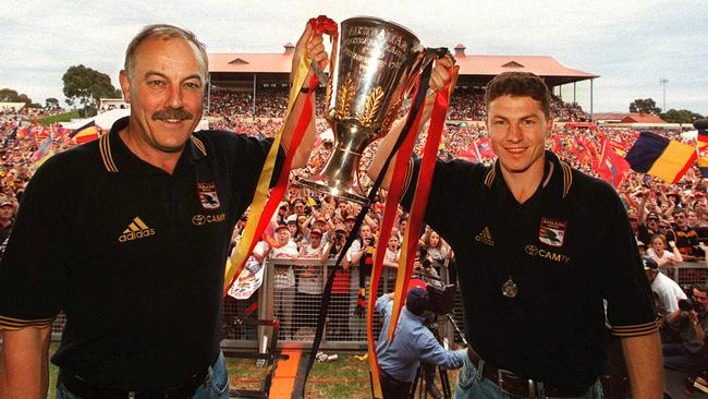 Crows coach Malcolm Blight and skipper Mark Bickley show off the 1998 premiership trophy after Adelaide’s win over North Melbourne. Picture: Ray Titus