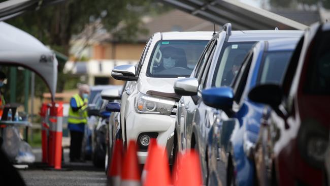 Drivers queuing for COVID-19 tests at the Prestons drive-through clinic after a COVID exposure at Casula Mall. Picture: Jonathan Ng