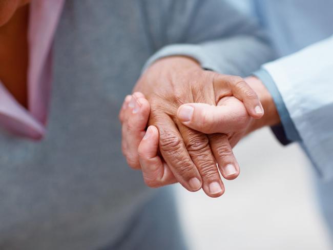 Doctor holding patient's hand. thinkstock