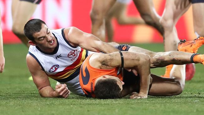 Crows skipper Taylor Walker brings Josh Kelly to the ground on Saturday. Picture: Matt King/AFL Media/Getty Images