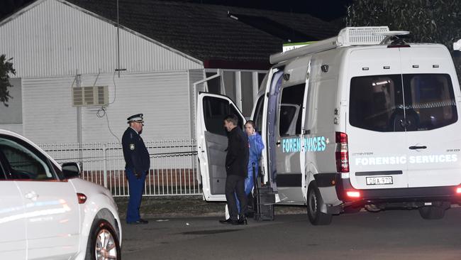 Forensic crews at the scene of the shooting. Picture: Gordon McComiskie