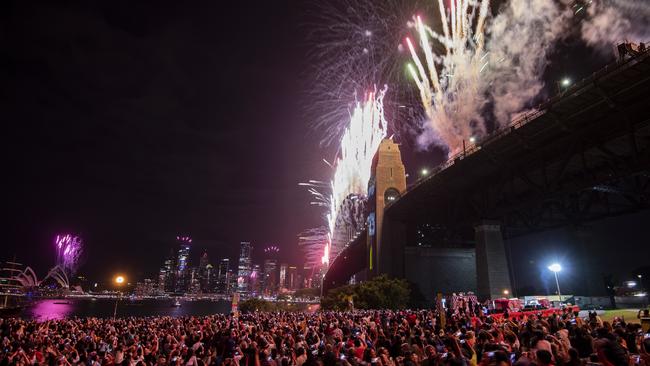 The Sydney Harbour shoreline at Kirribilli is always packed with revellers. Picture: Monique Harmer.