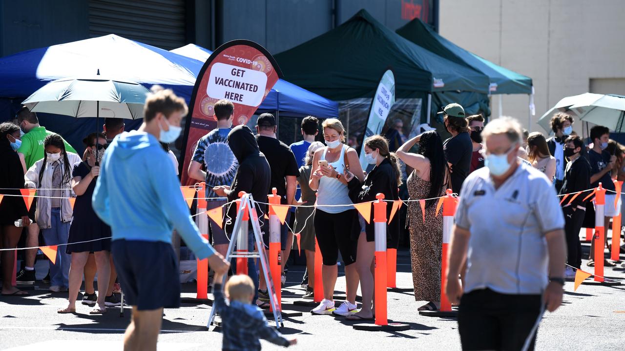 People queue to receive a Covid-19 vaccine at a Bunnings.