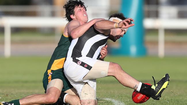 Marion’s Dean Conier tackles Reynella’s Paul Munce in a Southern Football League game this year. Picture: Stephen Laffer.