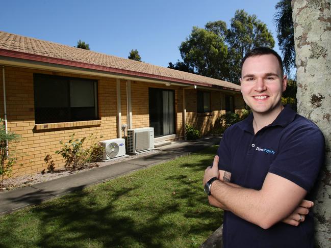 Eddie Dilleen (correct), Property Investor & Buyers Agent, posing infant of a unit he owns on Chambers Flat Rd, Marsden, Brisbane, on Tuesday, August 21, 2018.  (AAP Image/Steve Pohlner)