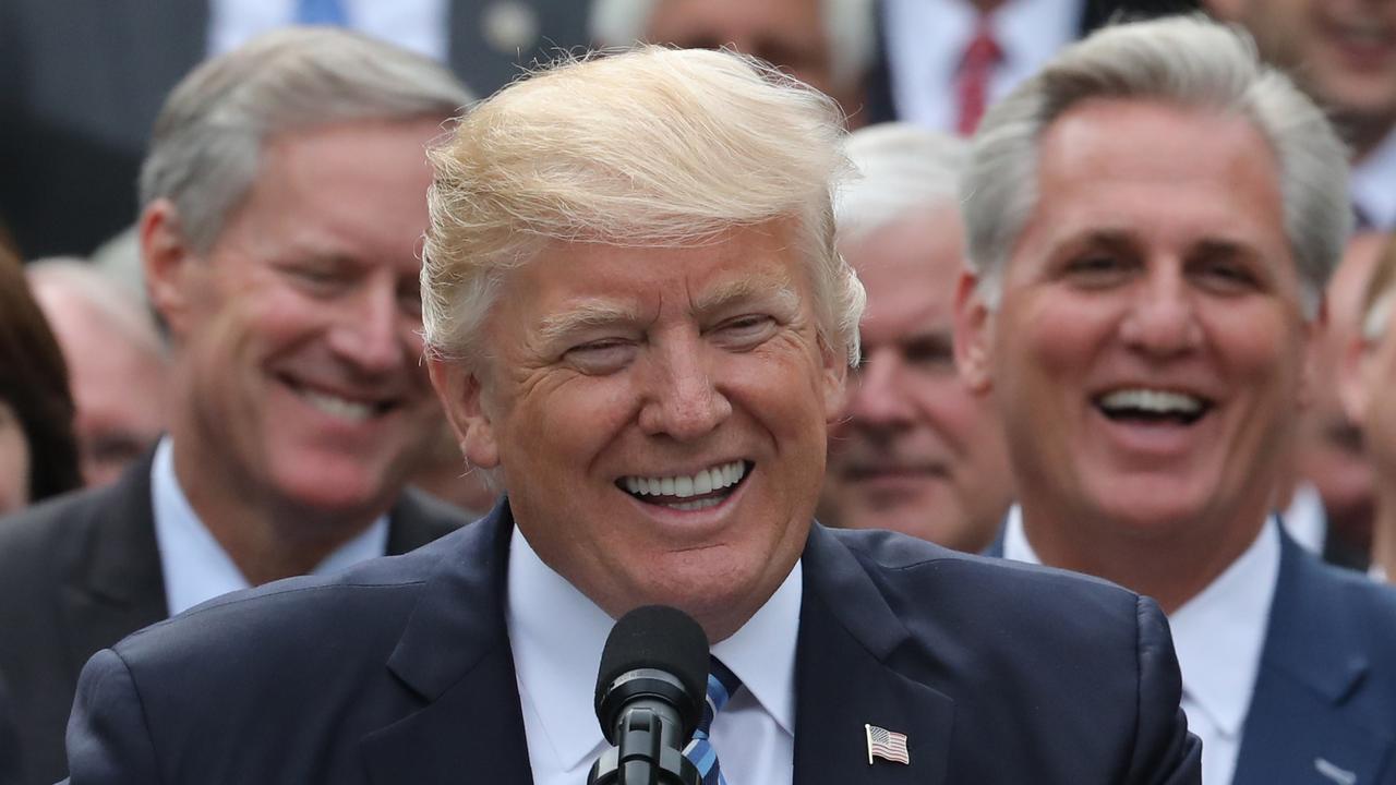 Mr Meadows, left, with the President and House Majority Leader Kevin McCarthy in 2017. Picture: Reuters/Carlos Barria