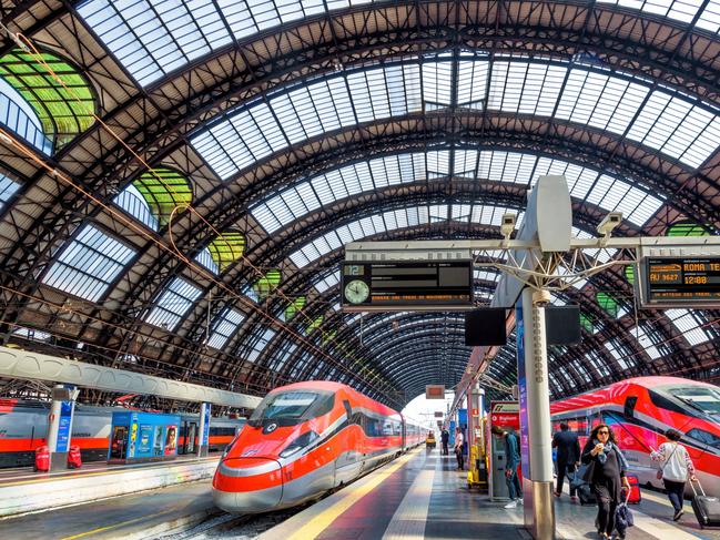 Milan, Italy - May 17, 2017: Modern high-speed trains at the railway Milan Central Station. Industrial landmark and tourist place of Milan. Concept of travel and transport across Milan and Europe.