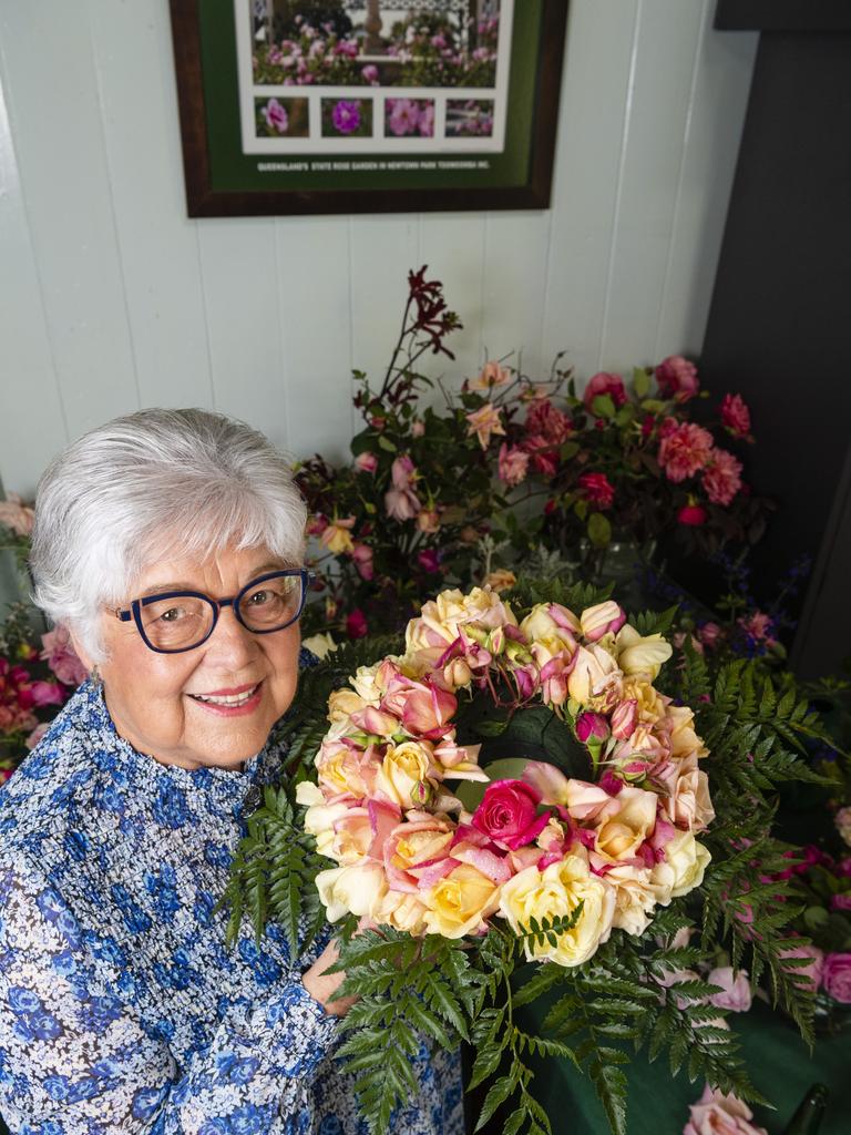 Heritage Roses in Australia member Bonita Cattell with a members wreath on show in the 2022 Spring Champion Rose Show at the Rose Cottage in the Queensland State Rose Garden, Saturday, October 8, 2022. Picture: Kevin Farmer