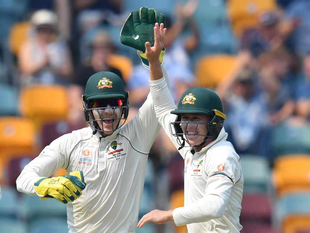 Tim Paine connects with his shot at Kohli.