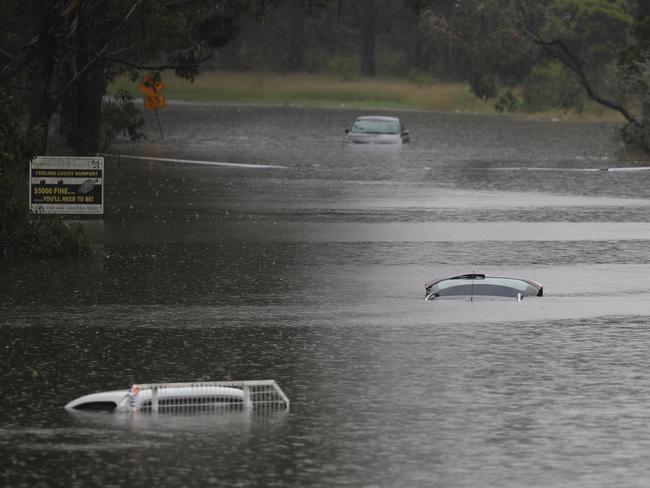 Off Blacktown rd between Windsor and Richmond water everywhere cars underwater on Racecause rd and homes & businesses off Bennett rd are under water .picture John Grainger