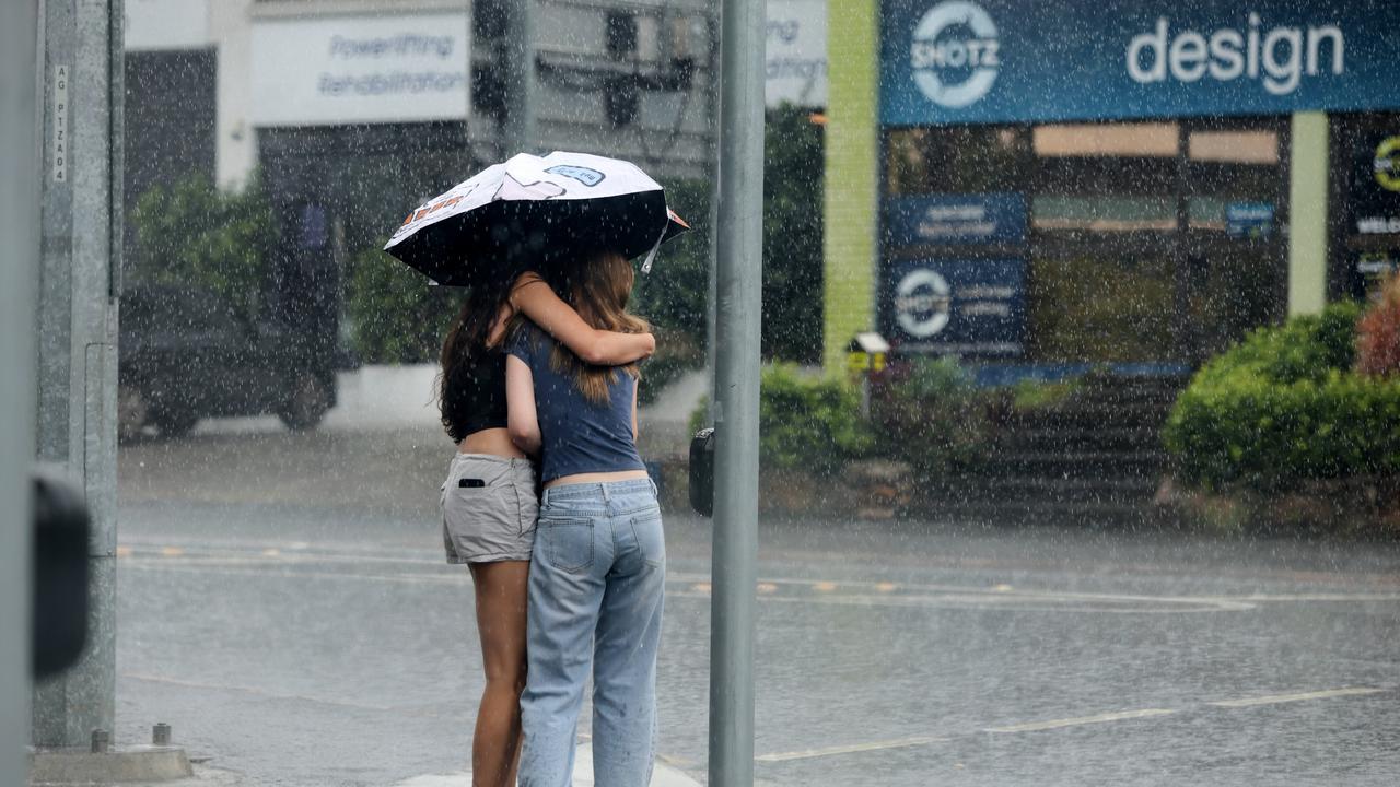 A sudden downpour of rain caught a lot of people out and caused flashed flooding around Brisbane. Picture David Clark