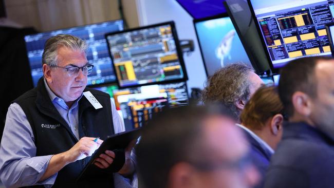 Traders work on the floor of the New York Stock Exchange. Picture: Michael M. Santiago/AFP