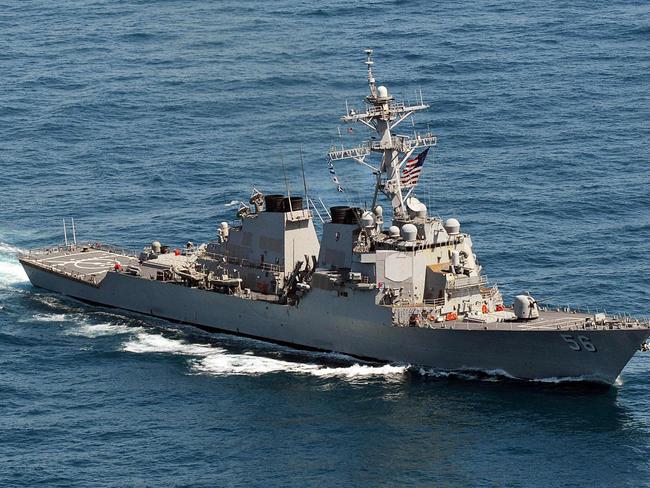 (FILES) This US Navy file photo taken on March 21, 2013 shows the Arleigh Burke-class guided-missile destroyer USS John S. McCain (DDG 56) sailing in the waters off the Korean Peninsula. A US warship on August 10, 2017 sailed close to an artificial island China has built up in the South China Sea, as part of a "freedom of navigation" operation, a US official said.The USS John S. McCain destroyer sailed within six nautical miles of Mischief Reef, part of the disputed Spratly Islands south of the Paracel Islands.Speaking on condition of anonymity, the official told AFP a Chinese frigate sent radio warnings at least 10 times to the USS McCain.  / AFP PHOTO / US NAVY / HO / RESTRICTED TO EDITORIAL USE - MANDATORY CREDIT "AFP PHOTO / US NAVY /DECLAN BARNES/HANDOUT" - NO MARKETING NO ADVERTISING CAMPAIGNS - DISTRIBUTED AS A SERVICE TO CLIENTS