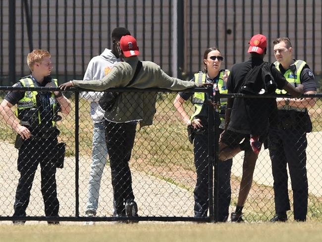 African youth loiter outside The Ecoville Community Park in Tarneit. Picture: David Smith