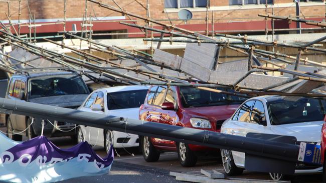 Scaffolding accident on Mann St in Gosford has seen eight cars and one ute crushed.  Picture: Fiona Killman