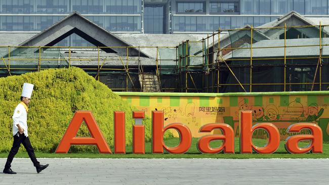 In this photo taken on Aug. 27, 2014, a chef walks in the headquarter campus of Alibaba Group in Hangzhou in eastern China's Zhejiang province Foreigners who want to buy Alibaba Group shares in the Chinese e-commerce giant’s U.S. public offering will need to get comfortable with an unusual business structure.(AP Photo) CHINA OUT