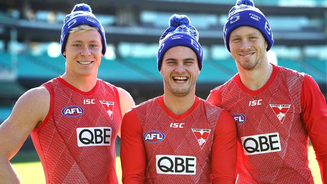 Isaac Heeney, Tom Papley and Callum Mills with the beanies for the Big Freeze, raising funds and awareness to fight MND. The beanies will be available at the game on Sunday. Picture. Phil Hillyard