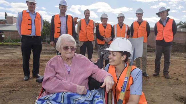 SHOVEL READY: Whiddon Group Grafton’s oldest resident Maisie McLean, aged 105, and the facility’s employee of the year Sherrie-Lee Rediger look over the building site with executives and developers. Photo: Adam Hourigan