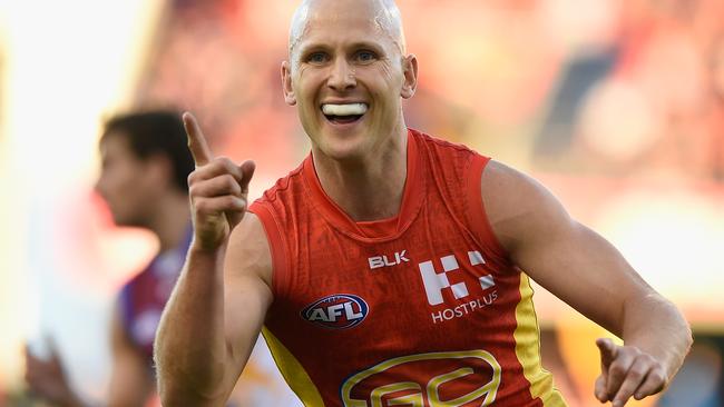 Ablett of the Suns celebrates kicking a goal against the Lions.