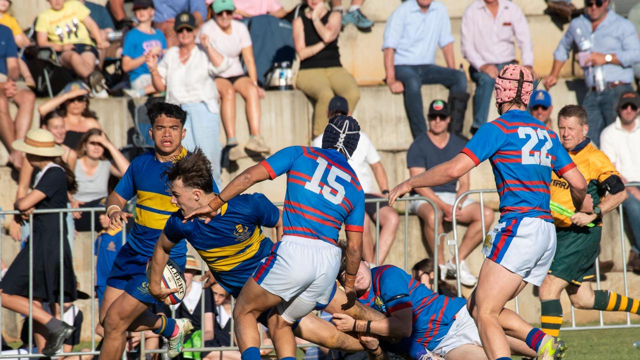 Trace Beattie offloads for TGS. 2024 O'Callaghan Cup at Downlands College. Photo by Nev Madsen