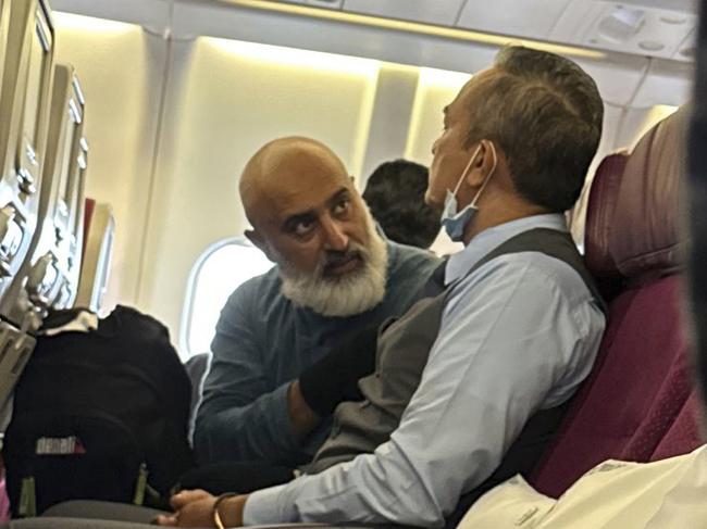 Pictured is the man at the centre of an “emergency situation” unfolding at Sydney Airport, the AFP says. , , Malaysia Airlines flight MH122 was grounded following departure earlier on Monday afternoon following an altercation involving this man. Video shows the man confronting flight attendants.,