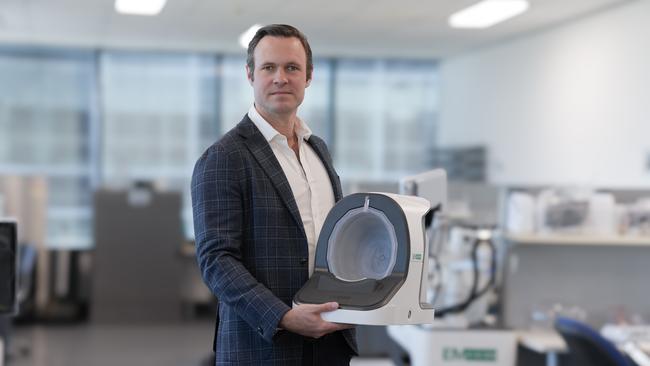 EMVision chief executive Scott Kirkland with the new portable brain scanner that weighs about 10kg and can detect a stroke in about five minutes.