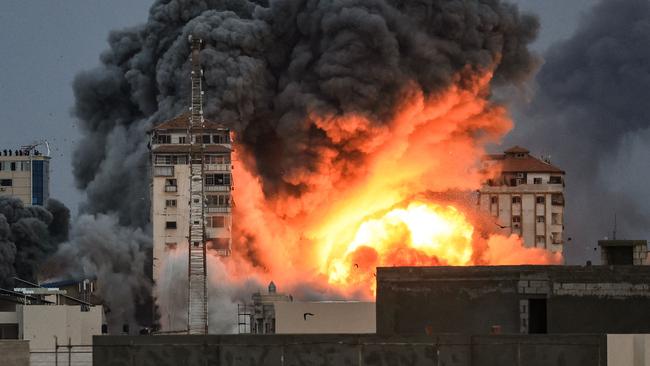 Fire and smoke rise above a building in Gaza City. Picture: Mahmud Hams/AFP