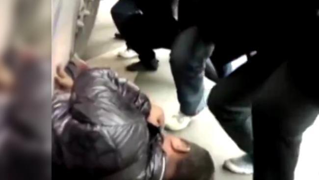 Watch the moments a crowd rescues a man trapped under a bus in China